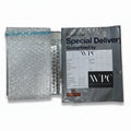 Royal Mail Special Delivery envelope with bubble wrap on a gray surface